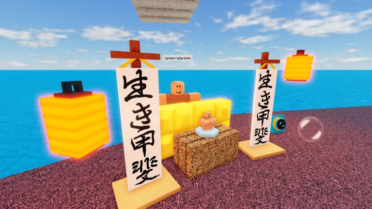 Two tall white banners with black writing and two glowing yellow lanterns beside a hay bale on a red shore by blue water